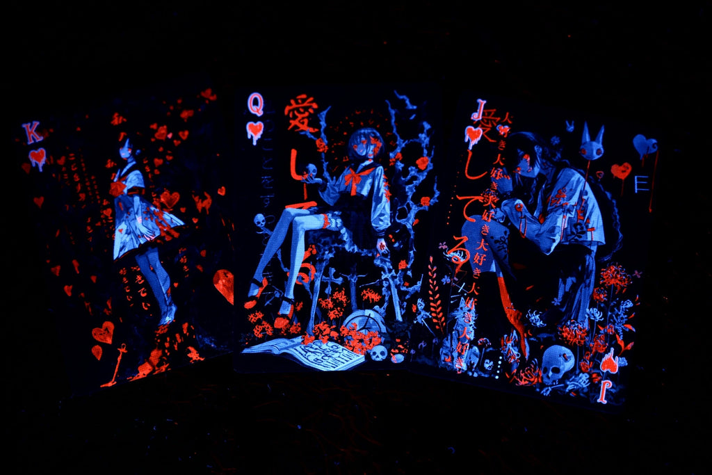 Leaf deck court cards glowing under UV light
