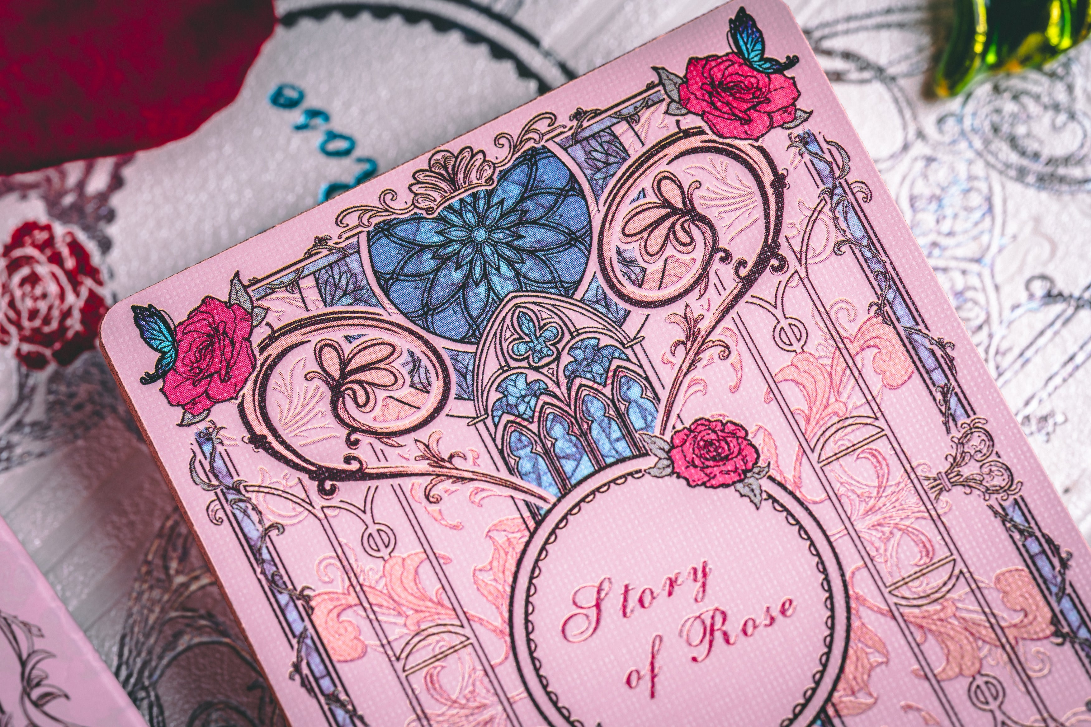 Story of Rose pink deck floral card-back detail