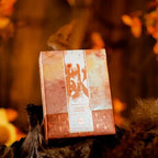 NANA Four Seasons Autumn tuck box among autumn leaves